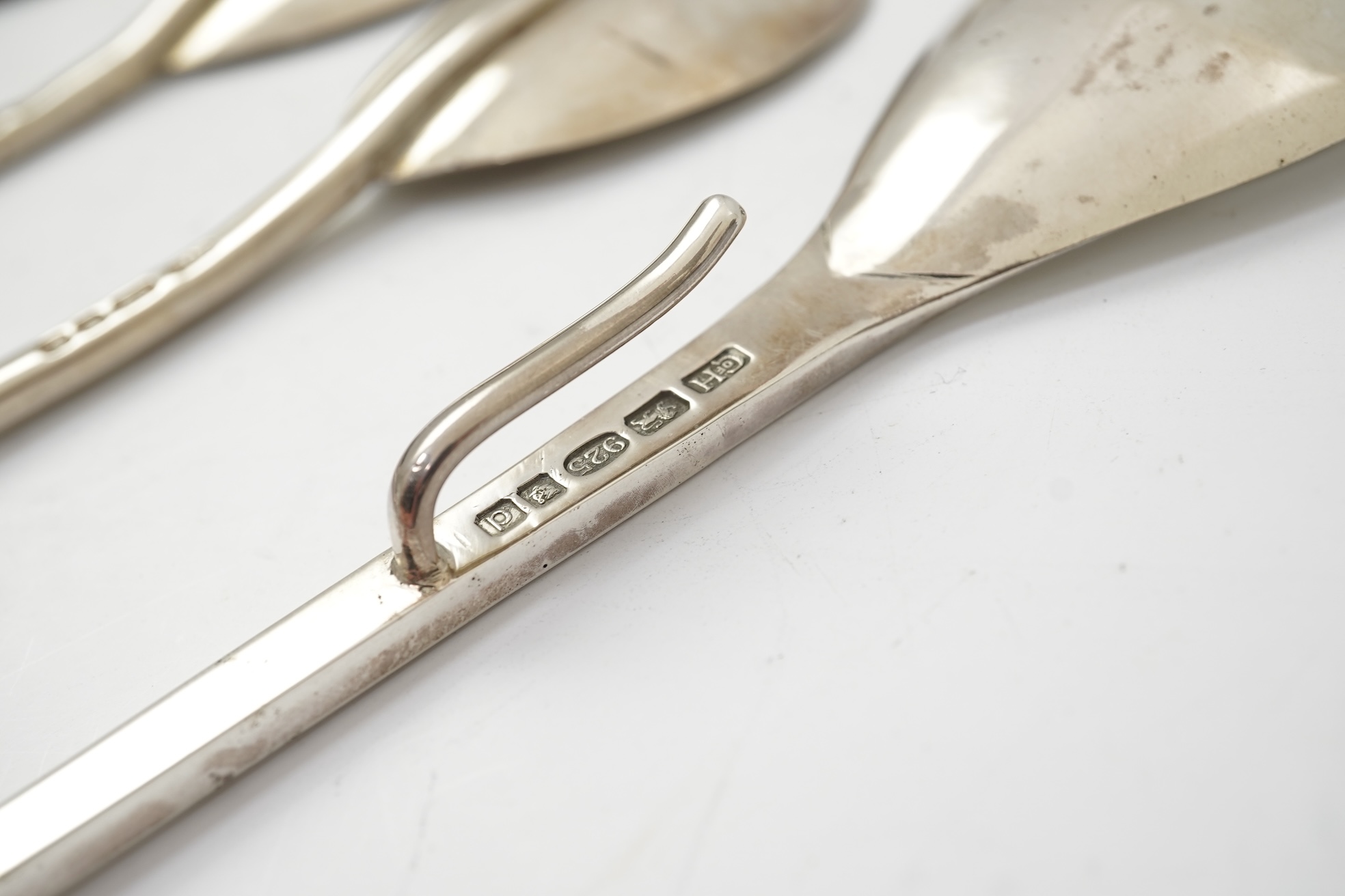A pair of Elizabeth II silver 'seal top' spoons by The Guild of Handicrafts, London, 1990, 16cm, together with a similar later spoon, London, 2008 and a similar preserve spoon, London, 2003, two with boxes.